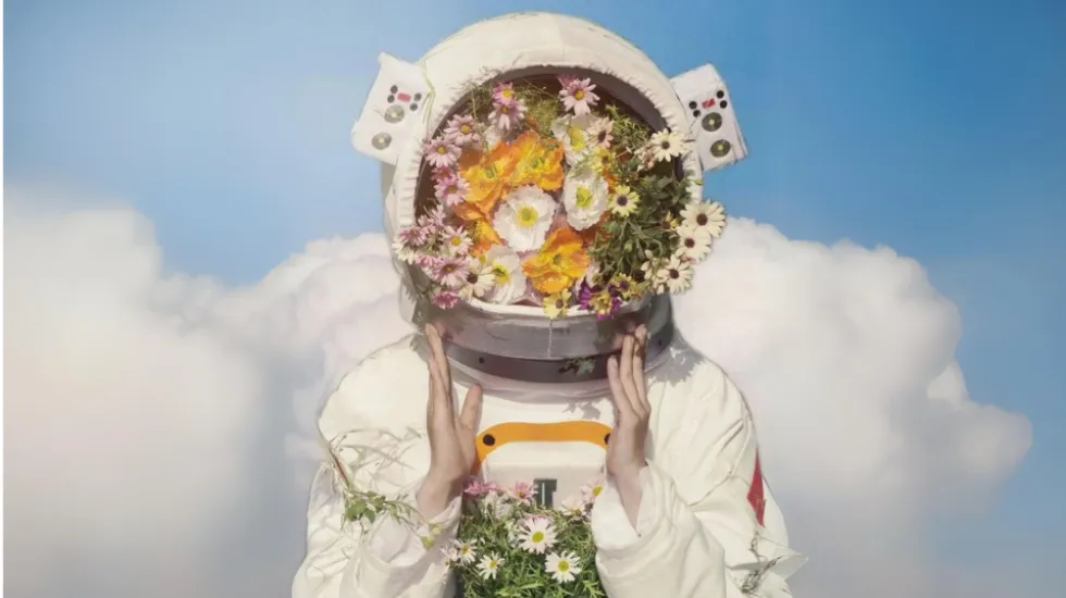 Astronaut in space with flowers