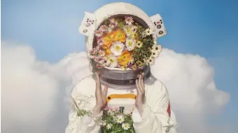 Astronaut in space with flowers